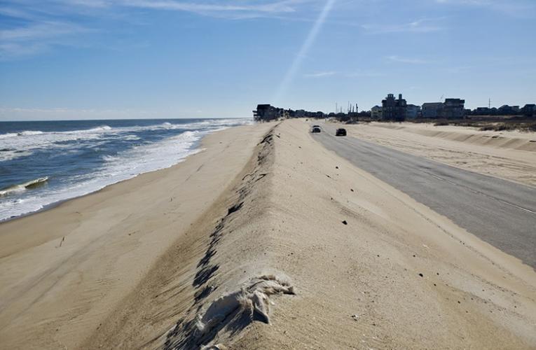 Sea, sand dunes and a highway at north end of the Village of Rodanthe, N.C.