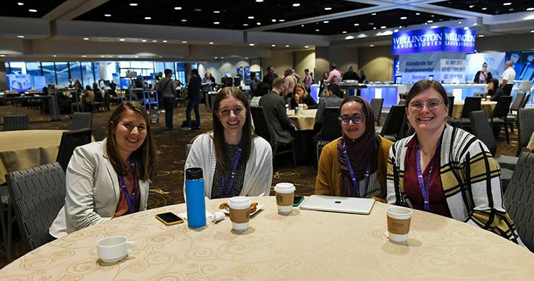 Group of Stapleton Lab members at table