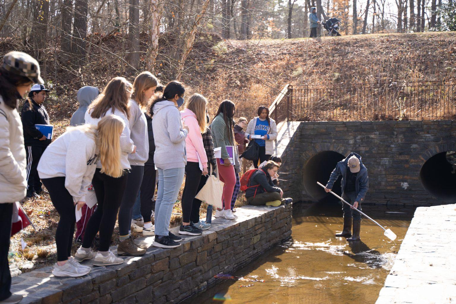Testing water quality near the Duke Reclamation Pond with Duke professor Dr. Neal Flanagan