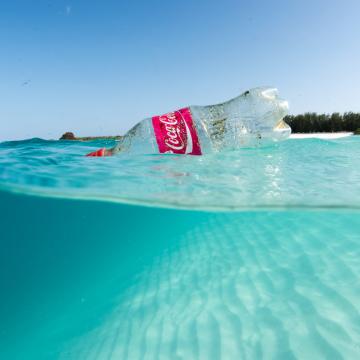 Plastic bottle floats on the ocean