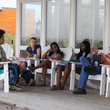 students in class on front porch