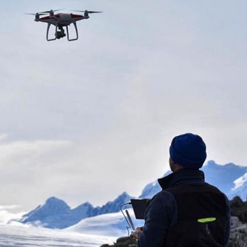 Marine Robotics and Remote Sensing Laboratory member piloting a drone 