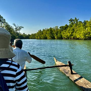 Horan and partner paddle down body of water in Madagascar